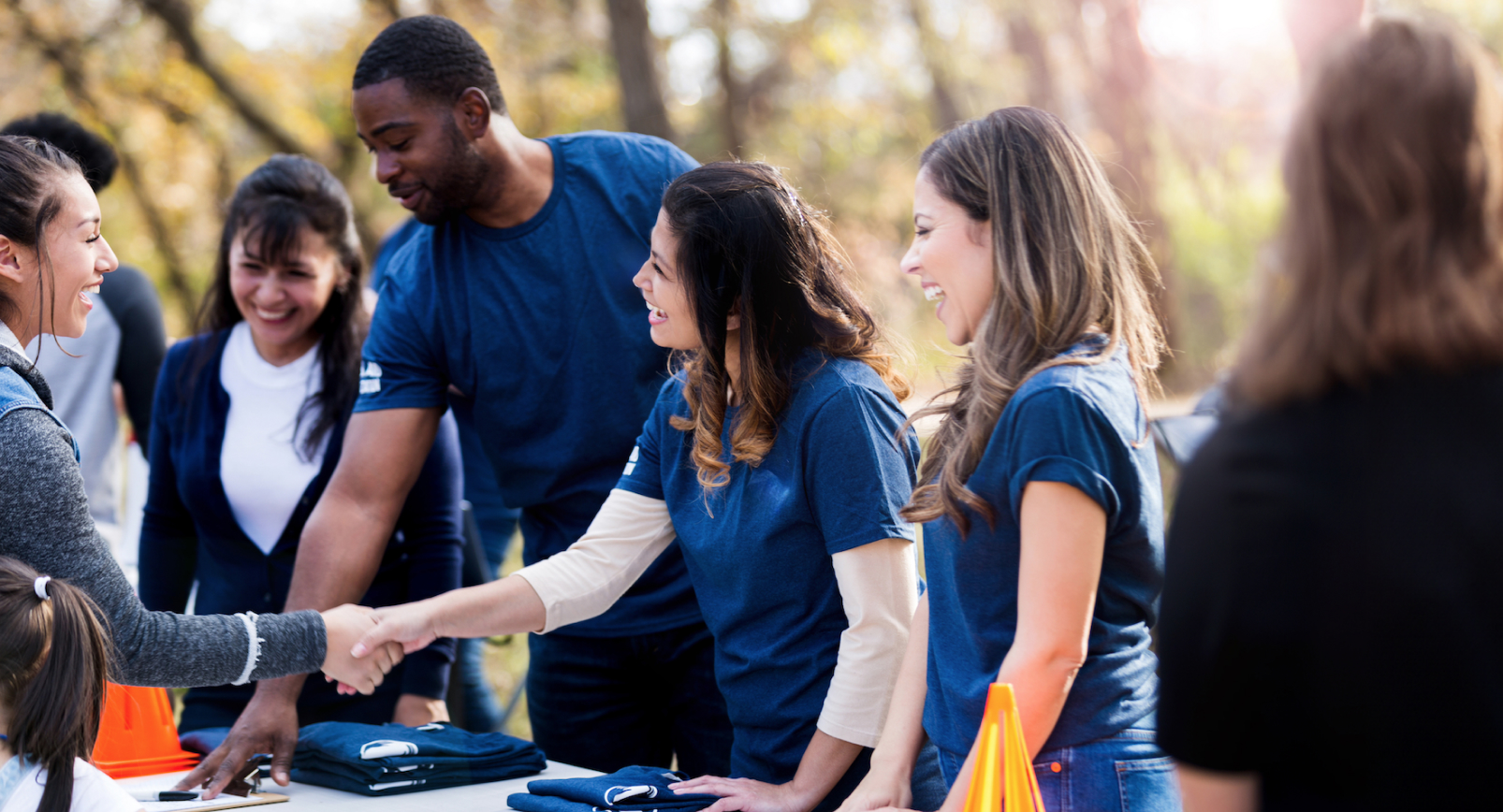 Image of an event services manager greeting an attendee